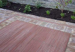Garden paving with creasing tiles on edge